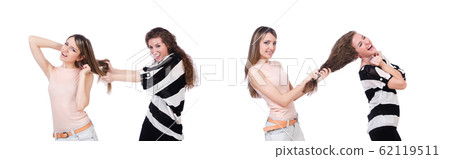 Two female friends isolated on the white Two female friends isolated on the white 62119511