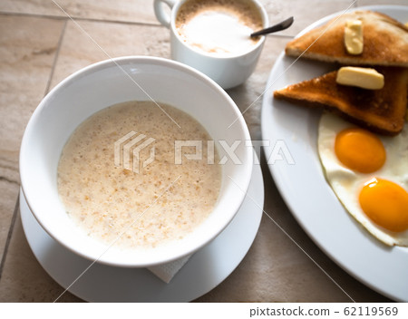 Oatmeal and Scrambled Eggs with Breakfast Toast Oatmeal and Scrambled Eggs with Breakfast Toast 62119569