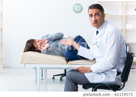 Mentally ill woman patient during doctor visit 62119573