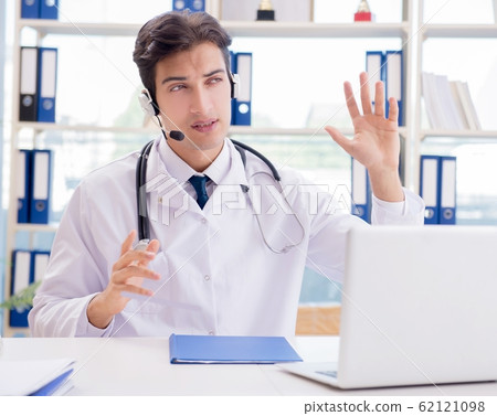 Young male doctor in telehealth concept Young male doctor in telehealth concept 62121098