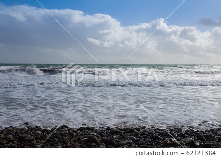 Pebbles, Mediterranean sea and a cloudy sky Pebbles, Mediterranean sea and a cloudy sky 62121384