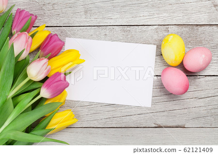 Easter greeting card with eggs and tulips Easter greeting card with eggs and tulips 62121409