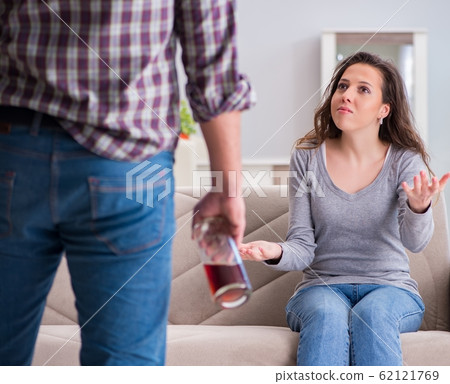 Domestic violence concept in a family argument with drunk alcoho Domestic violence concept in a family argument with drunk alcoho 62121769