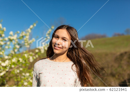 Portrait of a young beautiful teenager girl in a 62121941