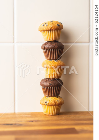 Sweet muffins. Chocolate cupcakes. Sweet muffins. Chocolate cupcakes. 62124154