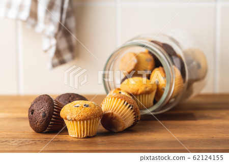 Sweet muffins. Chocolate cupcakes. Sweet muffins. Chocolate cupcakes. 62124155