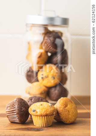 Sweet muffins. Chocolate cupcakes. Sweet muffins. Chocolate cupcakes. 62124156