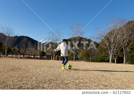 Girl playing soccer Girl playing soccer 62127602