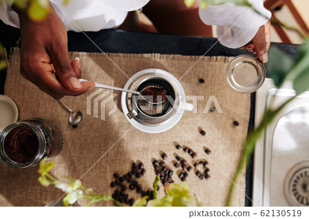 Woman making Vietnamese coffee Woman making Vietnamese coffee 62130519