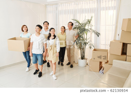 Family entering new house Family entering new house 62130934