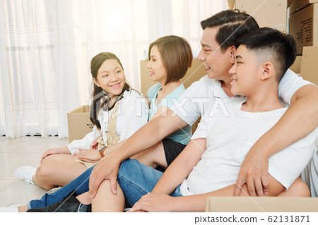 Family resting after moving in 62131871