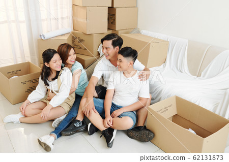 Parents and kids in new apartment 62131873