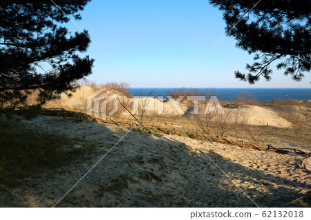 Sunset view of nordic dunes at Curonian spit, Nida, Klaipeda, Lithuania 62132018