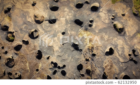 Natural stone courtyard with many holes, Aerial 62132950