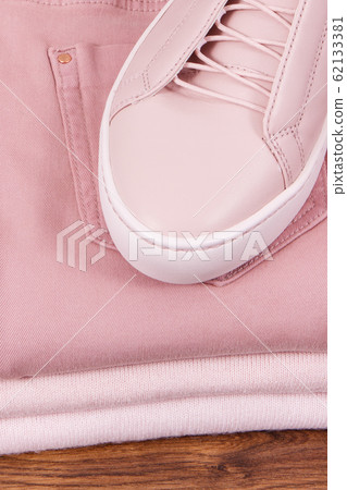 Leather shoes and stack of clothing for woman Leather shoes and stack of clothing for woman 62133381