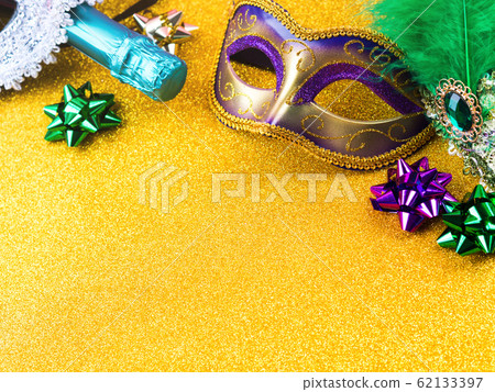 Colorful mardi gras carnival masks on golden 62133397