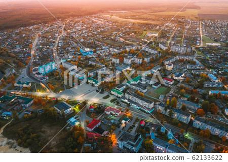 Dobrush, Gomel Region, Belarus. Aerial View Of Dobrush Cityscape Skyline In Autumn Evening. Residential District And River During Sunset. Bird's-eye View 62133622