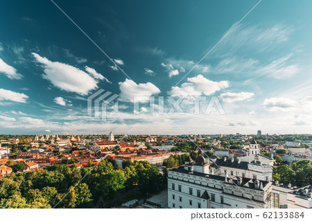 Vilnius, Lithuania. Old Town Historic Center Cityscape Under Dramatic Sky And Bright Sun In Sunny Summer Day. Travel Panorama. UNESCO. Famous And Popular Place Vilnius, Lithuania. Old Town Historic Center Cityscape Under Dramatic Sky And Bright Sun In Sunny Summer Day. Travel Panorama. UNESCO. Famous And Popular Place 62133884