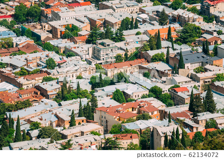 Tbilisi Georgia. Aerial View Of Residential Area. Buildings With Red White Roofs And Green Trees 62134072