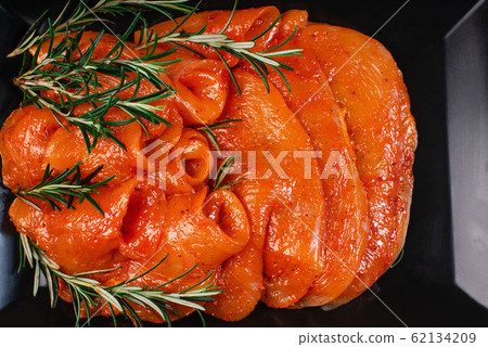 Satilisimo in a marinade. Raw chicken thinly sliced slices in a marinade with spices, satilisimo. Marinated raw meat. Dietary meat. Cooking. Satilisimo in a marinade. Raw chicken thinly sliced slices in a marinade with spices, satilisimo. Marinated raw meat. Dietary meat. Cooking. 62134209