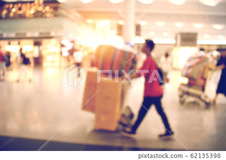 Traveler at airport with baggage 62135398