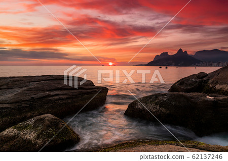 Sunset on the ocean at Rio de Janeiro, Ipanema beach. Brazil 62137246
