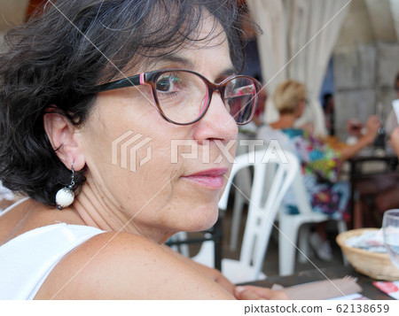 Portrait of a middle-aged brunette woman with 62138659