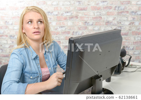 Young woman working on computer Young woman working on computer 62138661