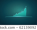 Tablet showing holographic graphs and stock market 62139092