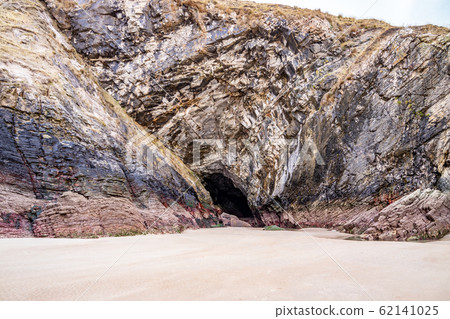 The beach and caves at Maghera Beach near Ardara, County Donegal - Ireland. The beach and caves at Maghera Beach near Ardara, County Donegal - Ireland. 62141025
