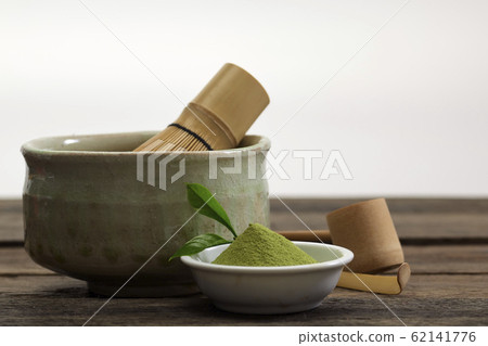 Organic Green Matcha Tea in a Bowl 62141776