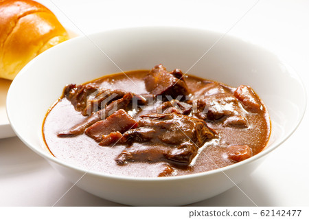 Beef tongue stew. Set menu with roll bread. (White plate, white background) 62142477