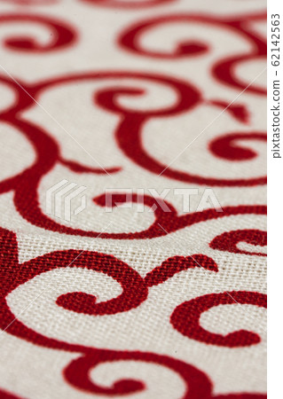 Macro shot of traditional Japanese geometric pattern arabesque red and white fabric focus and bokeh of synthetic fiber 62142563