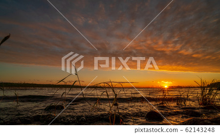 Beautiful lake in Karelia on sunset Beautiful lake in Karelia on sunset 62143248