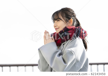 Women holding hands together Women holding hands together 62143450
