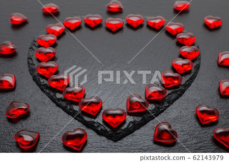 valentines day background with red hearts on black valentines day background with red hearts on black 62143979