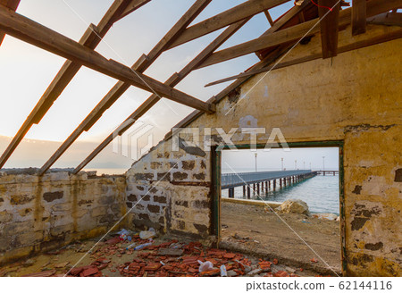 Pier and sea view through derelict house by the beach in Argaka, Cyprus Pier and sea view through derelict house by the beach in Argaka, Cyprus 62144116