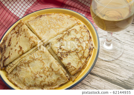 Traditional Russian food, delicious pancakes on a plate, stacked stack. The carnival and seeing the Russian winter, view from above Traditional Russian food, delicious pancakes on a plate, stacked stack. The carnival and seeing the Russian winter, view from above 62144935