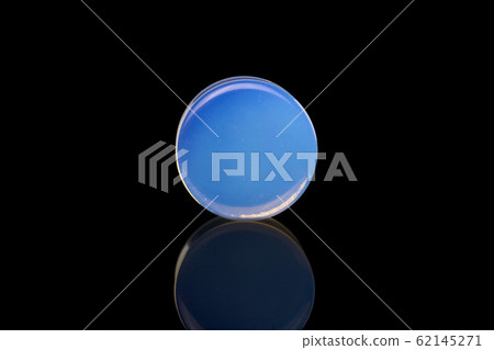 Stylish ear plug isolated on black glass Stylish ear plug isolated on black glass 62145271