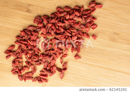 Red dried goji on light wood Red dried goji on light wood 62145291