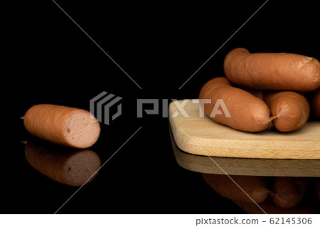 German pork sausage isolated on black glass German pork sausage isolated on black glass 62145306