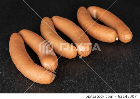 German pork sausage on grey stone 62145307