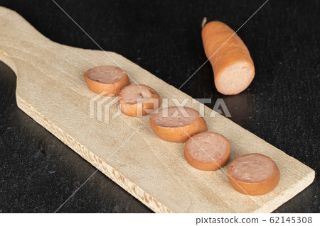 German pork sausage on grey stone German pork sausage on grey stone 62145308