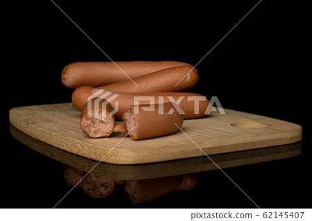German pork sausage isolated on black glass German pork sausage isolated on black glass 62145407
