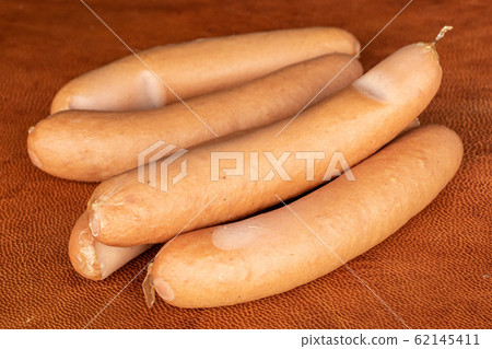 German pork sausage on cognac leather German pork sausage on cognac leather 62145411
