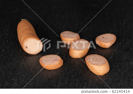 German pork sausage on grey stone German pork sausage on grey stone 62145414