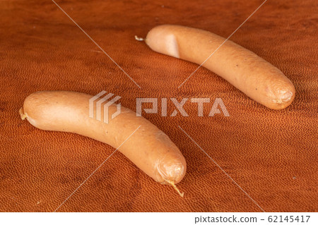 German pork sausage on cognac leather German pork sausage on cognac leather 62145417