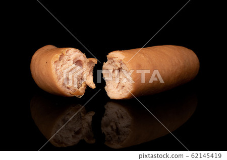 German pork sausage isolated on black glass German pork sausage isolated on black glass 62145419