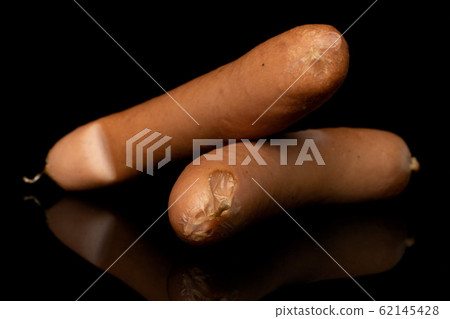 German pork sausage isolated on black glass German pork sausage isolated on black glass 62145428