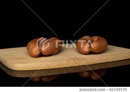 German pork sausage isolated on black glass 62145570